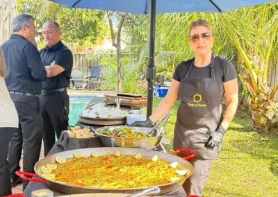 Chef preparing authentic Spanish paella on site in Fort Lauderdale