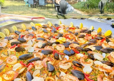 Fresh seafood paella catering cooked live poolside in Broward County Florida